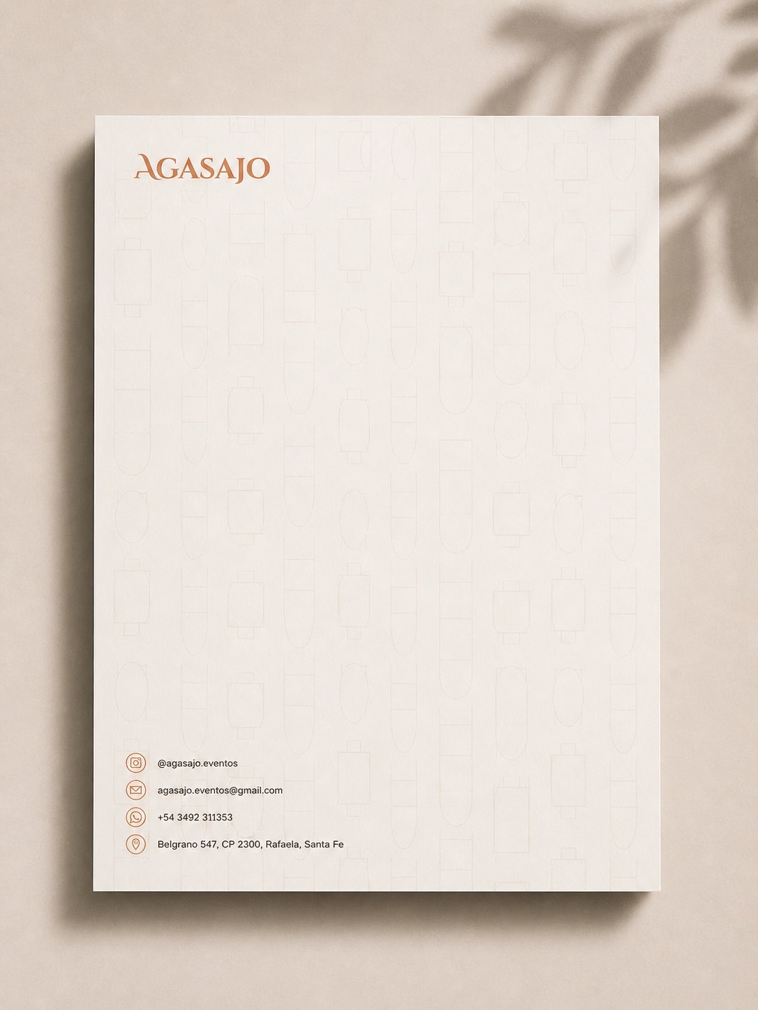 Hoja membretada de Agasajo sobre fondo cálido